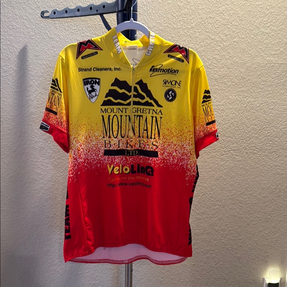 In motion men’s Vibrant Yellow and Red Cycling Team Jersey. Size XL